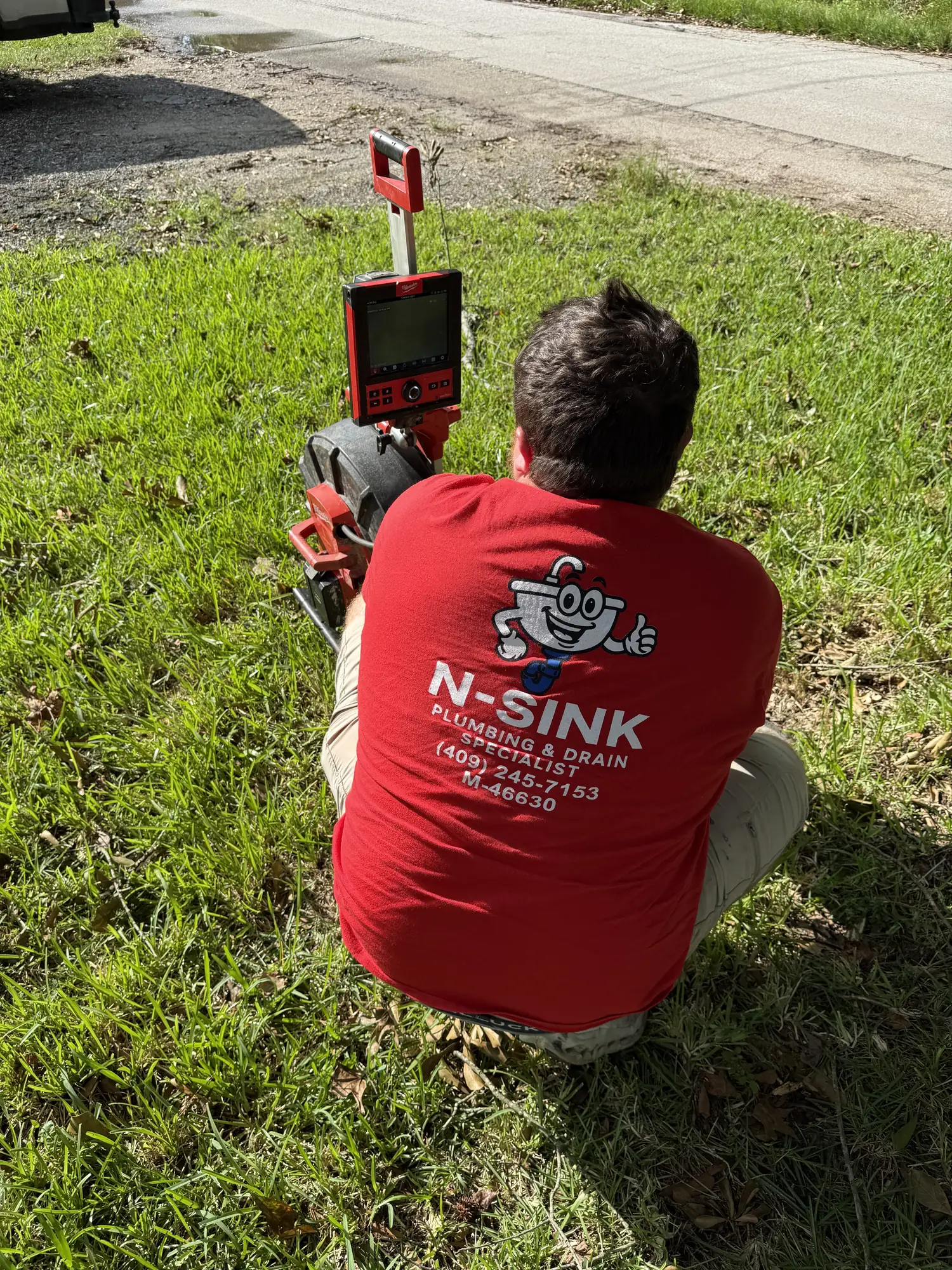 N-Sink running a camera inspection down a residential drain line
