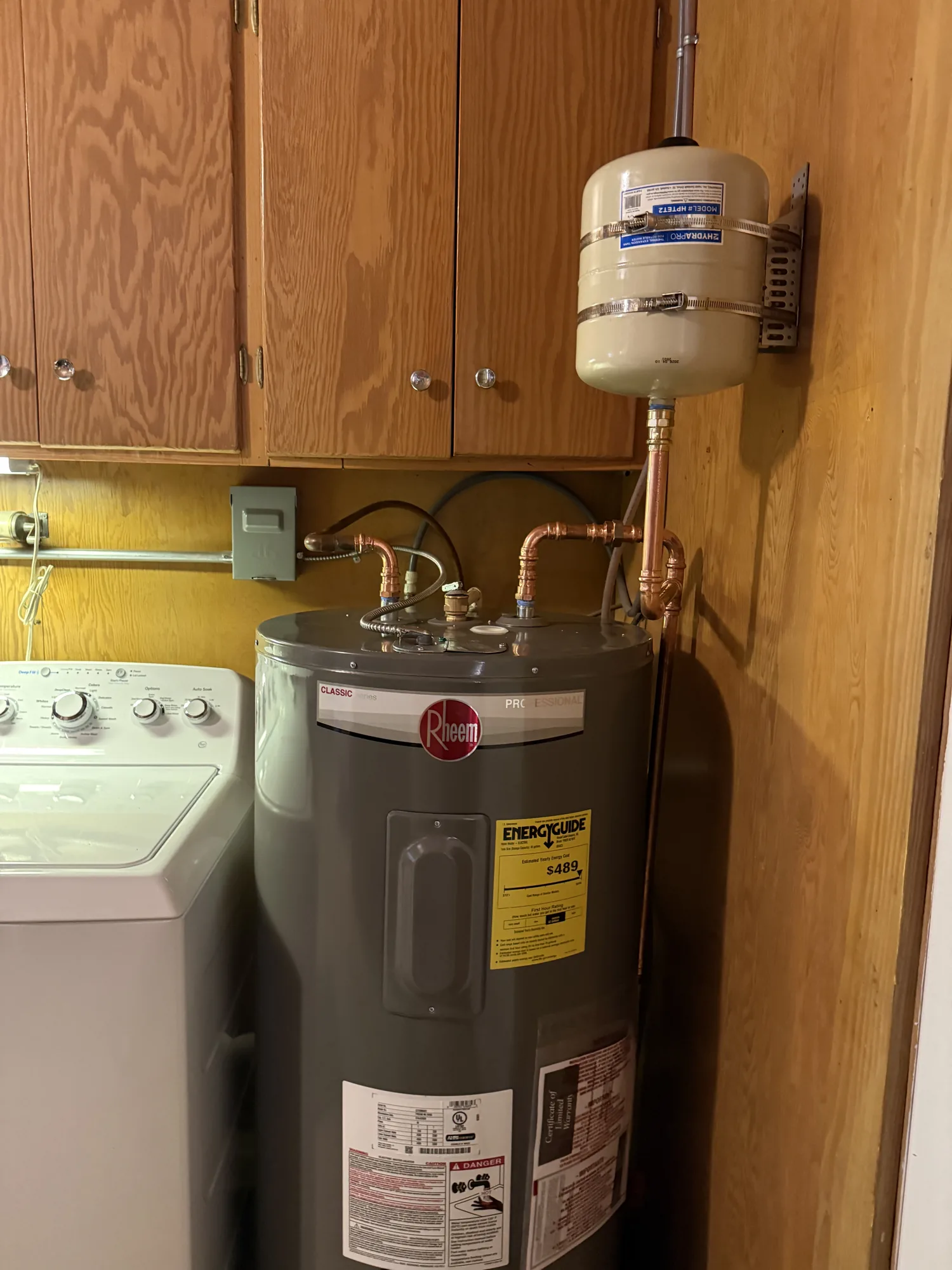 New Rheem electric water heater with thermal expansion tank installed in Fannett, TX